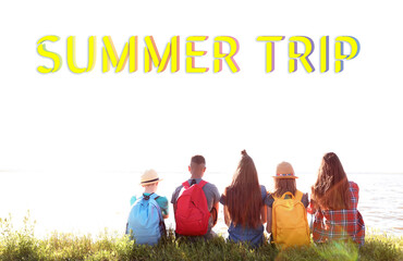 Group of children with backpacks on coast. Summer trip