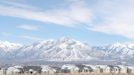 Panorama frame Striking Wasatch Mountains and South Jordan City in Utah during winter season