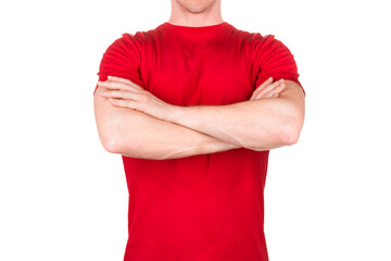 Front view of confident male in blank red t-shirt posing with crossed arms