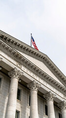 Vertical crop Pedimented entrance of historic Utah State Capital building in Salt Lake City