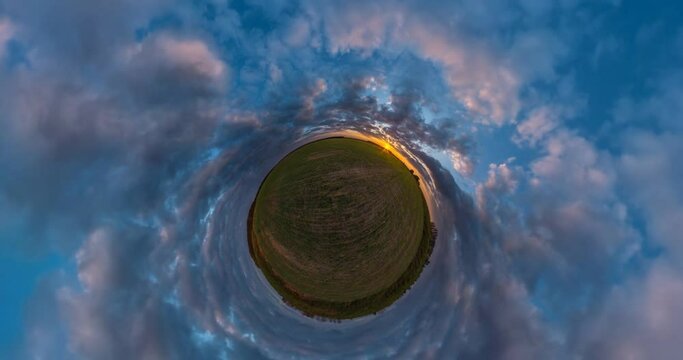 little planet revolves among beautiful evening fluffy clouds. Little planet Transformation with curvature of space. loop rotate
