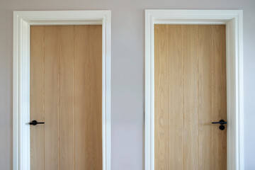 Close Up Of Two Wooden Doors In Modern House Symbolizing Choice