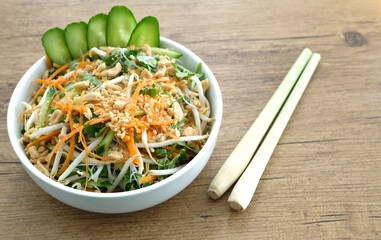 Summer rice noodles salad with fresh vegetable and roasted peanuts. 