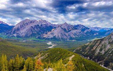 rocky mountain landscape with valley on cloudy day