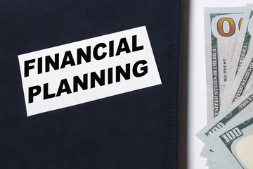 Financial planning - dollar or banknotes with handwriting notepad