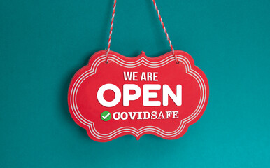 Hanging sign board of we are open covid safe, hotel Concept with copy space
