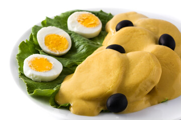 Traditional Peruvian papa a la huancaina isolated on white background