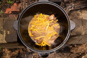 cooking pilaf in a cauldron