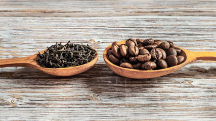 Tea and coffee in wooden spoons. Choice between tea and coffee