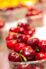 Greats cherries in the market. Red colors. fruits in the market. Background. Selective blur.