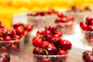 Cherries exposed in the market. Red colors. fruits in the market. Background. Selective blur.