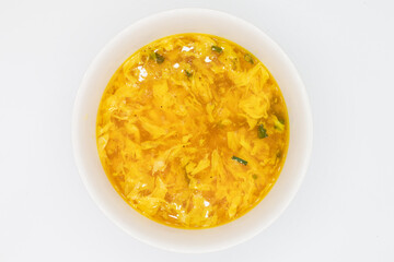 Chinese Egg Drop Soup in a White Bowl with a White Background