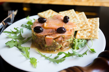 Salmon tartar with black olives