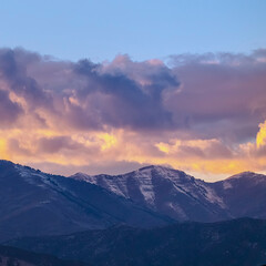 Square crop Clouds gathering over the mountain at sunset
