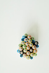 High angle view of different kinds of alkaline battery sorting for recycling isolated on white background