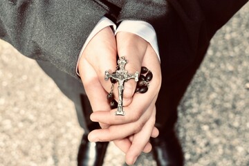 Child holding rosary