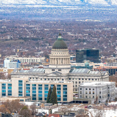 Obraz premium Square frame Utah State Capitol Building against a sweeping view of Salt Lake City in winter