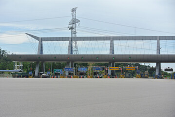 Fototapeta na wymiar SEREMBAN, MALAYSIA -MAY 26, 2020: Highway toll canopy in Malaysia. Vehicles that use the expressway through a toll plaza and make payments each time they enter and exit.