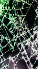 Multi-colored and bright broken smartphone screen close-up.