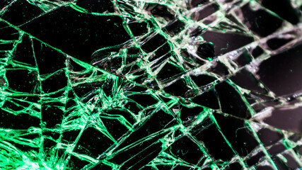 Multi-colored and bright broken smartphone screen close-up.