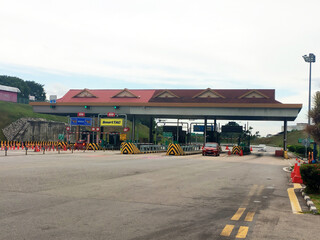 SEREMBAN, MALAYSIA -MAY 26, 2020: Highway toll canopy in Malaysia. Vehicles that use the expressway...