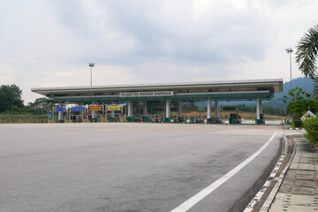Fototapeta na wymiar SEREMBAN, MALAYSIA -MAY 26, 2020: Highway toll canopy in Malaysia. Vehicles that use the expressway through a toll plaza and make payments each time they enter and exit.