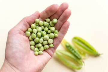 Fresh beans in woman hands, blurred