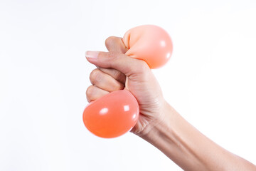 woman hand holding stress ball on isolated white background
