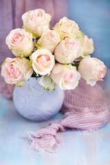 Close-up floral composition with a pink roses .Many beautiful fresh pink roses on a table.Pastel colors.
