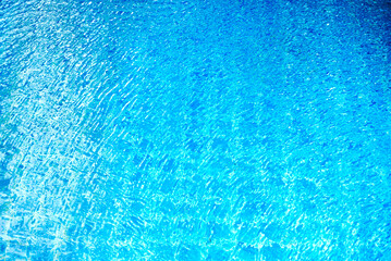 Topview water movment  in the blue swimming pool.