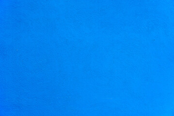 Blue color on concrete wall background texture.