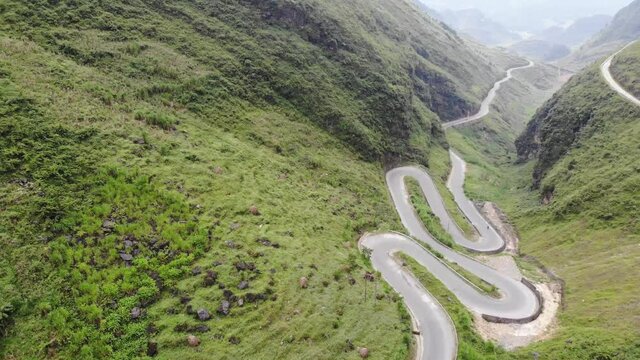 Aerial footage of Tham Ma mountain pass in Ha Giang province, north of Vietnam. Quan Ba heaven gate is legendary road of happiness gateway to the Dong Van geological park Ha Giang