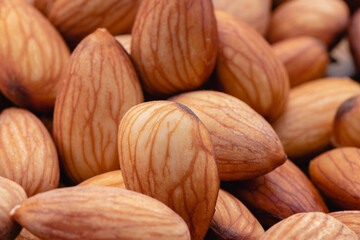 Almond beans soak in water overnight to get the most benefits before  to made almond milk, Health food with good fats and down aging, Antioxidants and lower cholesterol levels, Selective focus.