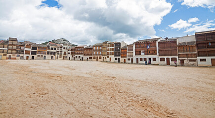 "Plaza del Coso" (square bullring) with medieval houses in Pe&ntilde;afiel, Valladolid (Spain).