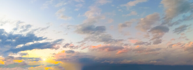 Naklejka na ściany i meble Beautiful panorama of the evening dramatic sky. Sunset or sunrise time. Amazing purple clouds.