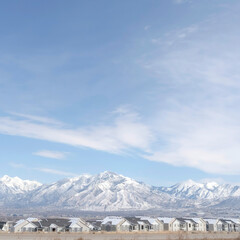 Square crop Panoramic view of South Jordan City neighborhood and Wasatch Mountains in winter