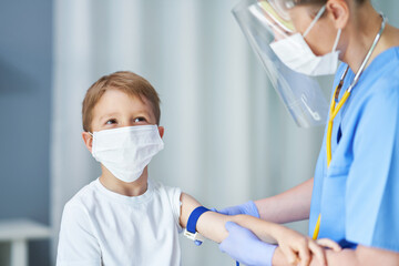 Fototapeta premium Portrait of adorable little boy having doctor's appointment