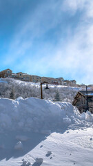 Vertical frame Town nestled amid sweeping terrain of Wasatch Mountain with snow in winter