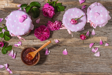 Homemade tea rose petal jam on a old wooden table