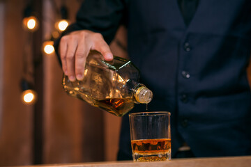 Barman pouring whiskey whiskey glass beautiful night