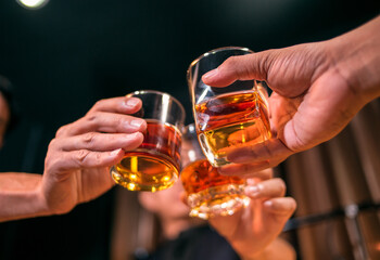 Barman pouring whiskey whiskey glass