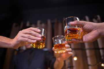 Barman pouring whiskey whiskey glass