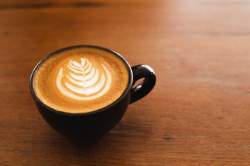 cup of coffee on wooden table