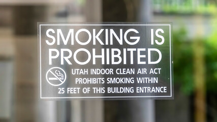 Panorama Smoking is Prohibited sign close up on clear glass door of building in Utah