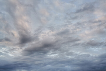 dramatic evening summer cloudscape. cumulus clouds panorama. cloud background