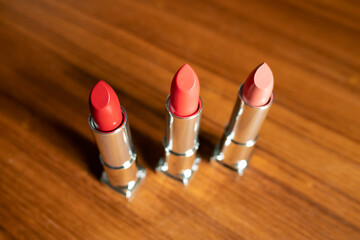 red lipstick on wood background
