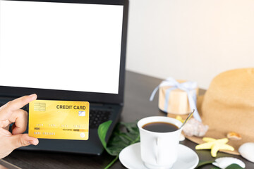 Laptop with blank screen for mockup eCommerce concept with paying money by use credit card. Online Technology Payment.