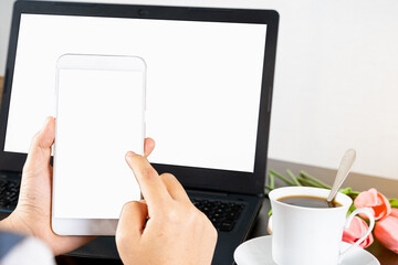 Laptop with blank screen for mockup eCommerce concept with paying money by use smartphone. Online Technology Payment.