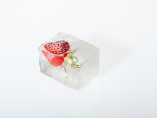 Strawberries frozen in the ice