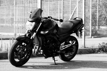 Obraz na płótnie Canvas Black motorcycle close-up on the street.